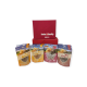 Eine rote Box mit der Aufschrift "Schweizer Qualität" enthält vier Pakete Haustierfutter: zwei "Soft Meaty" und zwei "Cat Sticks" mit Bildern von Katzen.