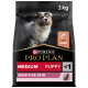Purina Pro Plan Medium Puppy Futter, 3 kg Beutel, mit einem Welpen auf der Vorderseite, gekennzeichnet für empfindliche Haut mit einem Fischsymbol.
