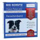 Blaue BIO SCHUTZ Protect Power plus Parasitenband-Box für Hunde mit lächelndem schwarz-weißem Hundefoto und '5 Monate Schutz'.