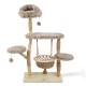 Arbre à chat beige en peluche avec plusieurs plateformes, jouets pompons suspendus et panier suspendu tissé sur une base en bois.