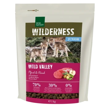 Sac de 1 kg de nourriture pour chiens Real Nature Wilderness Junior avec des chiots loups, étiqueté "Wild Valley" (Cheval & Bœuf), 70 % de viande, 30 % de fruits/légumes.