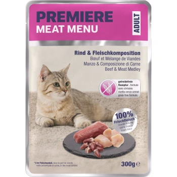 Cat sitting beside a pack of Premiere Meat Menu, featuring beef and meat medley, with text highlighting grain-free and fresh meat.