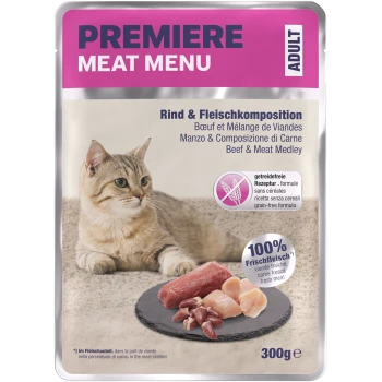 Cat sitting beside a pack of Premiere Meat Menu, featuring beef and meat medley, with text highlighting grain-free and fresh meat.