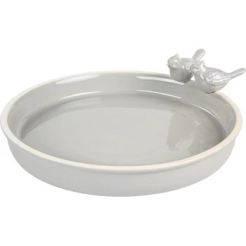A light gray ceramic pet water bowl with a smooth surface and a decorative feature of two small bird figurines perched on the rim.
