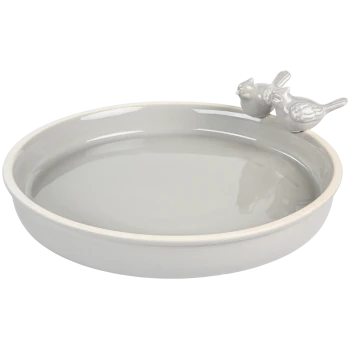 A light gray ceramic pet water bowl with a smooth surface and a decorative feature of two small bird figurines perched on the rim.