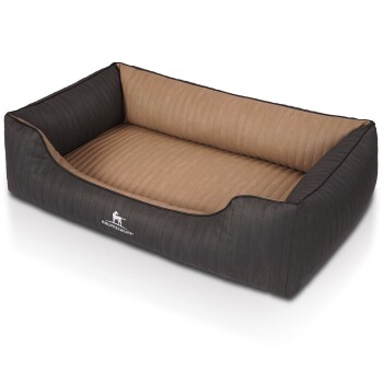 Ein stilvolles Hundebett mit schwarzem geripptem Äußeren und weichem, beige-farbenem Innenraum, mit dem Logo 'KNUFFELWUFF' an der Seite.