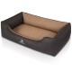 Ein stilvolles Hundebett mit schwarzem geripptem Äußeren und weichem, beige-farbenem Innenraum, mit dem Logo 'KNUFFELWUFF' an der Seite.