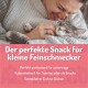 Hundetraining-Snack in einem pinken und schwarzen Behälter mit der Aufschrift "Ente ohne süß & sauer", mit hohem Fleischanteil und getreidefreier Formel.