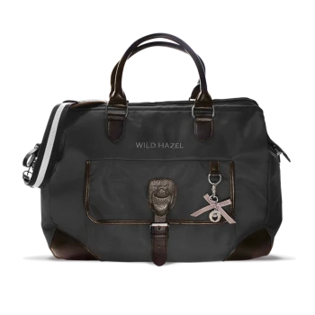 Stylische schwarze Tragetasche für Haustiere mit braunen Lederelementen, mit dem Markennamen "WILD HAZEL" und einem dekorativen Anhänger.