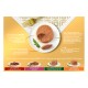 Pâté mousse GOURMET Gold pour chat sur assiette blanche avec basilic et cuillère, fourchette dorée sur fond orange avec texte produit