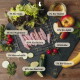 Rohe Kaninchenstreifen mit Aufschrift ‚60% Kaninchen‘ auf einer Schiefertafel mit Salat, Apfel, Banane und Zucchini sowie Beschriftung ‚Für Hunde‘.