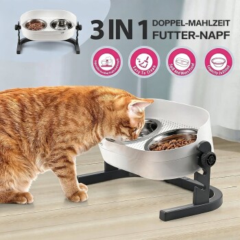 Orange getigerte Katze frisst aus erhöhter Doppelnapf-Futterstation; sichtbarer Text: „3IN1 DOPPEL-MAHLZEIT FUTTER-NAPF“.