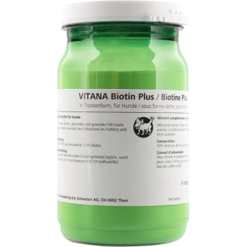 Grünes Glas VITANA Biotin Plus für Hunde, mit Nährwertangaben und Anwendungshinweisen auf dem Etikett.