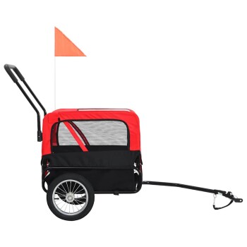 Roter und schwarzer Haustieranhänger mit Netzfenstern, einem Griff und einer Sicherheitsflagge, entworfen für den Transport von Haustieren.