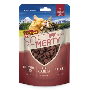 Opakowanie karmy dla zwierząt z dwoma kotami na malowniczym tle, oznaczone "DeliBest Soft Meaty Rind/Beef," podkreślające "Świeże mięso," "Bez cukru," "Bezglutenowe."