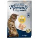 A tabby cat is shown next to a package of "Soft Rolls Moments" cat treats, featuring chicken with cheese flavor, 4 x 10g.