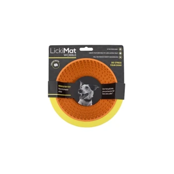 LickiMat Wobble dog toy in orange with a textured surface, featuring a black label stating "Microbust Toy" and "De-stress your dog!"