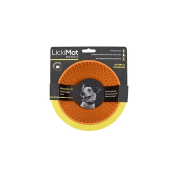 LickiMat Wobble dog toy in orange with a textured surface, featuring a black label stating "Microbust Toy" and "De-stress your dog!"