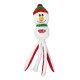 Un jouet pour chien en peluche en forme de bonhomme de neige avec un visage souriant, un chapeau vert et une écharpe rouge, présentant de longues jambes blanches et rouges à pois.