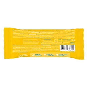 Rückseite eines Tierfutterpakets mit einem getreidefreien Rezept mit frischem Truthahn, reich an Vitaminen, und Nährwertinformationen.