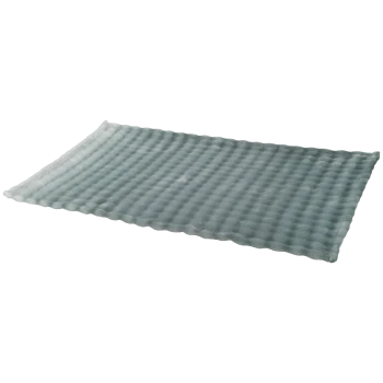 Tapis pour animaux rectangulaire en peluche bleu-vert clair avec texture matelassée à bulles.