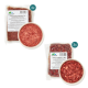 Zwei 500g-Pakete Wildfleischmischung, ein 500g-Paket Rentierfleisch und eine Schüssel mit rohem Fleisch, alle mit Nährwertangaben.