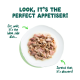 White plate of shredded wet pet food on green. Headline: LOOK, IT'S THE PERFECT APPETISER! Captions note it's the ideal side dish and dessert.