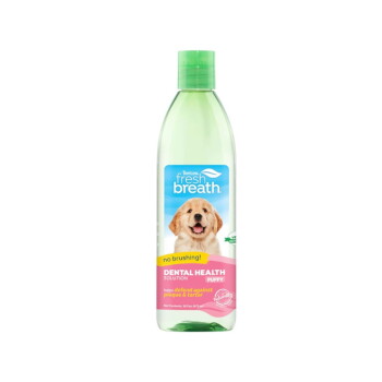 TropiClean Fresh Breath puppy dental health solution bottle, green cap, label with smiling puppy and text 'no brushing!'