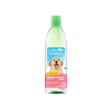 TropiClean Fresh Breath puppy dental health solution bottle, green cap, label with smiling puppy and text 'no brushing!'