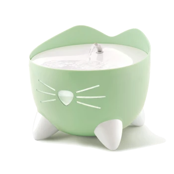 A green cat-shaped water fountain with a white top and a small stream of water flowing from the center, featuring whisker details.