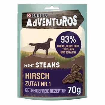 Verpackung von Purina AdVENTUROS Mini Steaks Hundeleckerlis, mit einer Silhouette eines Hundes, und Text, der 93% Fleischgehalt und ein getreidefreies Rezept hervorhebt.
