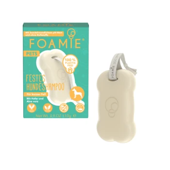 Stały szampon dla psów w kształcie kości, zapakowany w turkusowe pudełko oznaczone 'FOAMIE PETS FESTES HUNDESCHAMPOO' do krótkich włosów, wegański, 100% bez plastiku.
