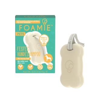 Stały szampon dla psów w kształcie kości, zapakowany w turkusowe pudełko oznaczone 'FOAMIE PETS FESTES HUNDESCHAMPOO' do krótkich włosów, wegański, 100% bez plastiku.