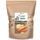 Eine 1-kg-Tüte REAVET-Hundefutter mit einem Wolf-Motiv, beschriftet mit "SCHONKOST FLOCKEN", mit einer Schüssel Futter und Karotten auf der Vorderseite.