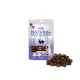 Verpackung von Natural Dog Chews Wild Rabbit Cubes mit einem Stapel von kaninchenaromatisierten Hundeleckerlis, mit einem Hundebild und dem Text '100% Lecker'.