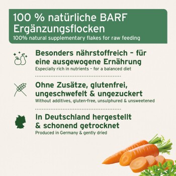Produktetikett: „100% natürliche BARF Ergänzungsflocken“ mit deutsch/englischen Angaben (glutenfrei, ohne Zusatzstoffe, hergestellt in Deutschland) und Karotten-Illustration.