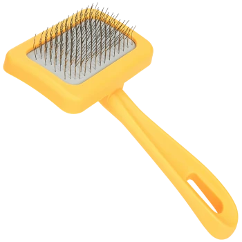 Yellow pet grooming brush with a rectangular head and metal bristles, designed for removing loose fur and tangles.