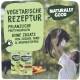 Eine Person hält eine Katze im Freien mit Grün. Der Text bewirbt vegetarisches Haustierfutter. Zwei "Natürlich gut"-Packungen und Gemüse sind sichtbar.