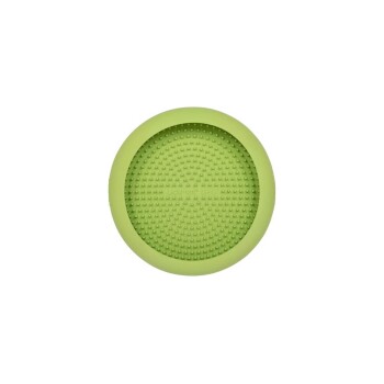 Grüne Silikon-Haustierpflegeunterlage mit strukturierter Oberfläche, entworfen zum Reinigen und Massieren von Haustieren.