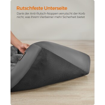 Eckhundebett mit rutschfester Unterseite, mit einer strukturierten schwarzen Oberfläche mit weißen Punkten für Stabilität und einem grauen Stoffoberteil.