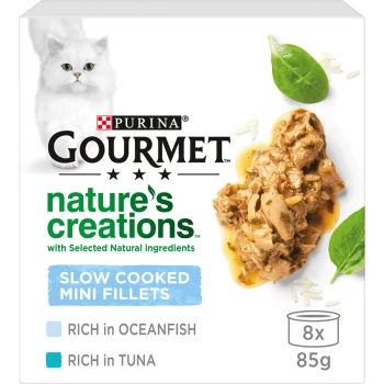 Purina Gourmet Nature's Creations cat food packaging featuring slow cooked mini fillets, rich in oceanfish and tuna, with a white cat image.