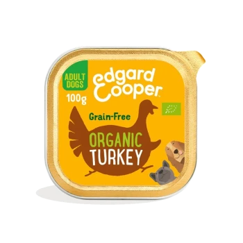 Nourriture pour chiens Edgard Cooper bio à la dinde, 100g, sans céréales, avec un dindon en dessin animé et des illustrations d'un chien et d'un lion.