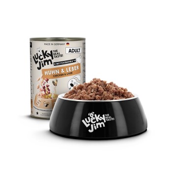 Schwarze Lucky Jim-Schüssel mit Huhn-&-Leber-Nassfutter neben einer Dose mit der Aufschrift 'Huhn & Leber / Chicken & Liver' und 'Adult'.