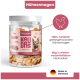 Hundeleckerlis mit rohen Hühnermägen, beschriftet mit "100% Hühnermagen," "0g," und "Ohne Zucker," von einer Hand gehalten. Ideal für das Training.