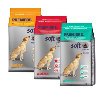 Drei Beutel PREMIERE weiches Hundefutter für Erwachsene, mit einem gelben, roten und grünen Design, jeweils mit einer Hundillustration und Nährstoffsymbolen.