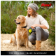 A woman in a sweater and beanie kneels with a golden retriever on a leash, surrounded by greenery and sand. Text: "THE ORIGINAL - MADE IN GERMANY."