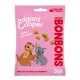 Un sac rose de friandises pour chiens Edgard Cooper avec un chien et un chiot en dessin animé, avec le texte "Petits morceaux" et "BONBONS" affiché en évidence.