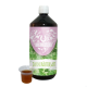 Eine Flasche 'Darmkräutersaft' für Haustiere, mit einem pinken und grünen Etikett, das Tierikonen zeigt, neben einer kleinen Tasse mit der Flüssigkeit.
