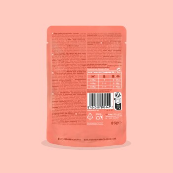 Dos d'un sachet pour animaux corail‑rose montrant un tableau d'alimentation, code‑barres, icônes et le nom de marque « edgardcooper », 85 g.