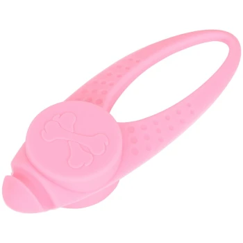 Jouet pour animaux en silicone rose en forme d'os, avec une prise texturée et un centre circulaire avec un design en forme d'os.